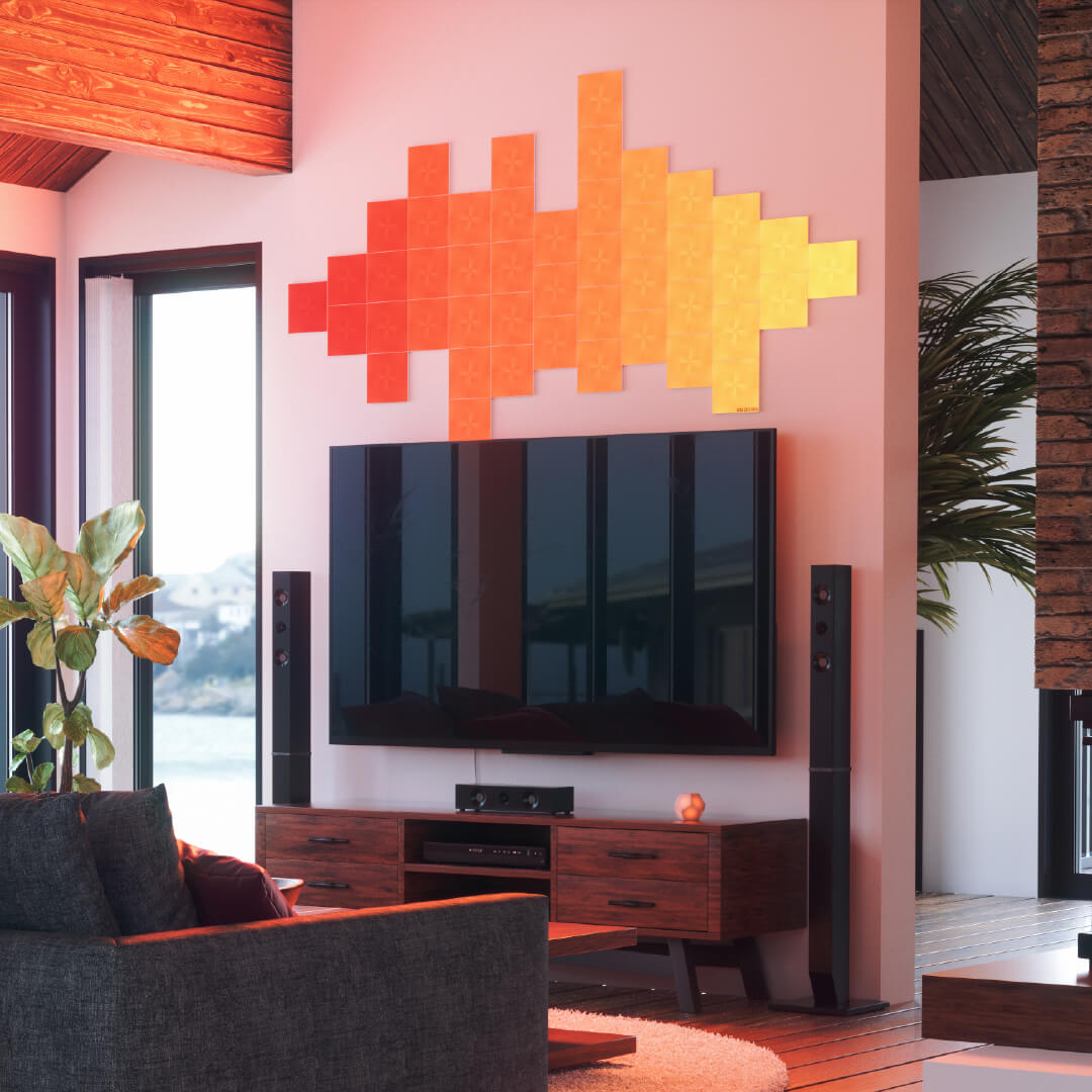 Nanoleaf Canvas color changing square smart modular light panels mounted to a wall in a living room. Similar to Philips Hue, Lifx. HomeKit, Google Assistant, Amazon Alexa, IFTTT.