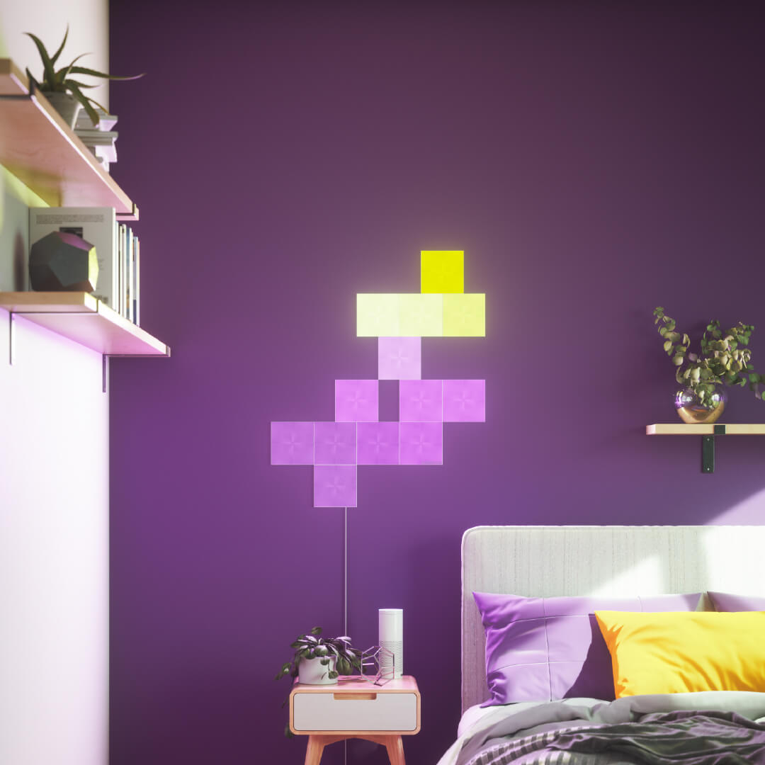 Nanoleaf Canvas color changing square smart modular light panels mounted to a wall in a bedroom. Similar to Philips Hue, Lifx. HomeKit, Google Assistant, Amazon Alexa, IFTTT.