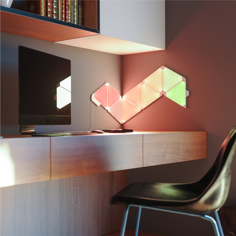 Nanoleaf Light Panels color-changing triangle smart modular light panels mounted to a wall in a home office. Similar to Philips Hue, Lifx. HomeKit, Google Assistant, Amazon Alexa, IFTTT.