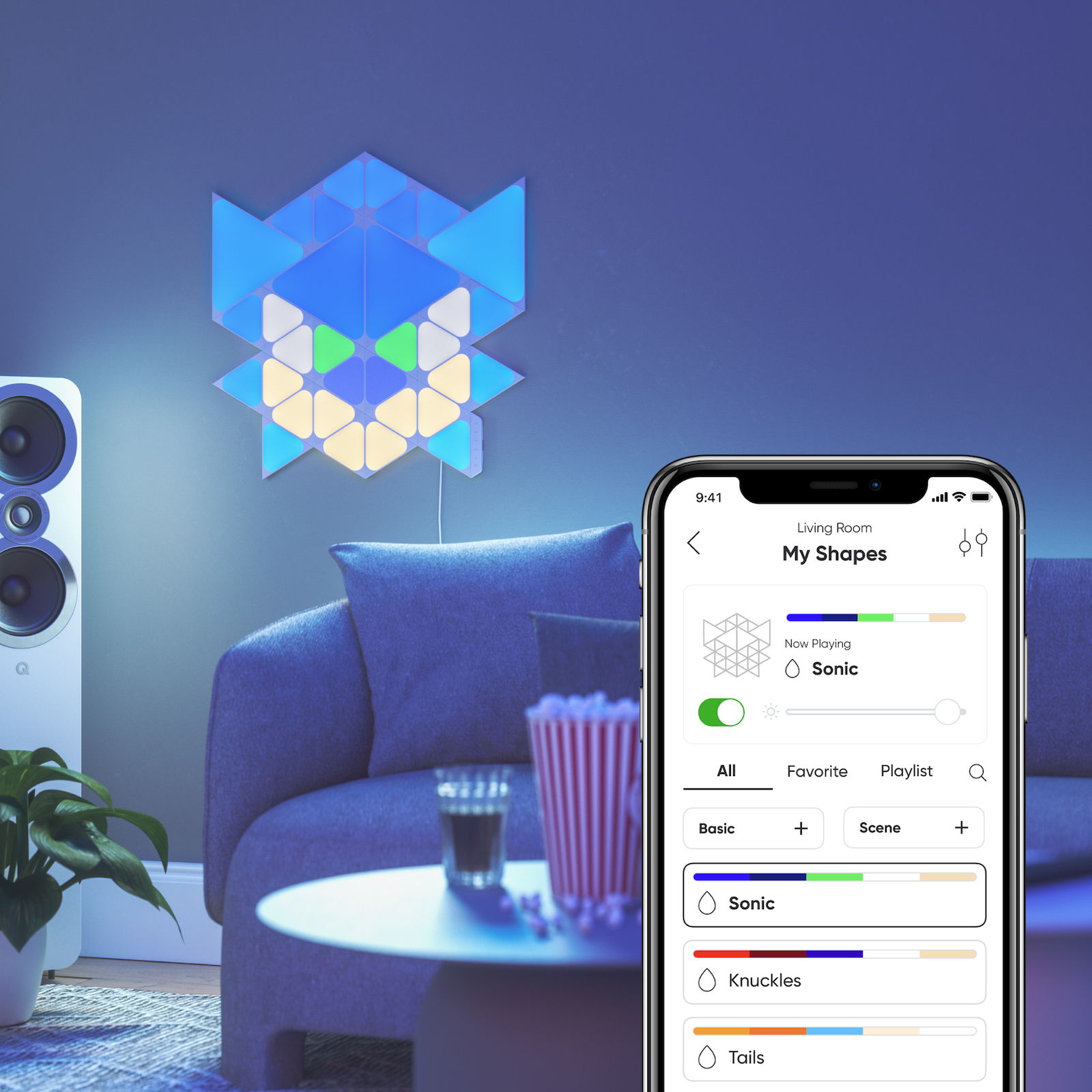 Nanoleaf Shapes Thread enabled color changing triangle and mini triangle smart modular light panels mounted to a wall in a living room as Sonic. Sonic the Hedgehog 2. Nanoleaf App. Similar to Philips Hue, Lifx. HomeKit, Google Assistant, Amazon Alexa, IFTTT.